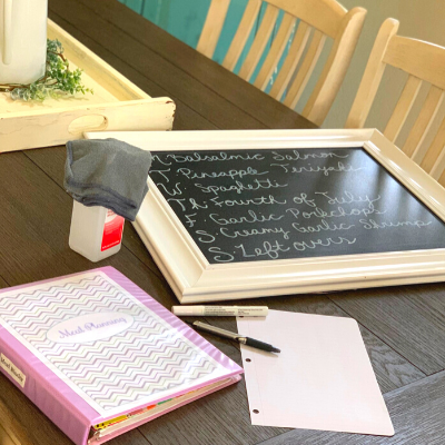 Chalkboard on table with binder