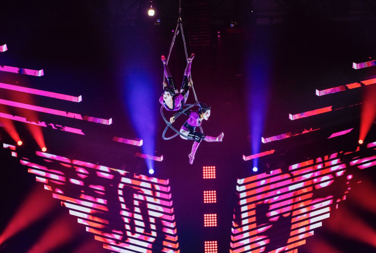 Two women coming down from the ceiling