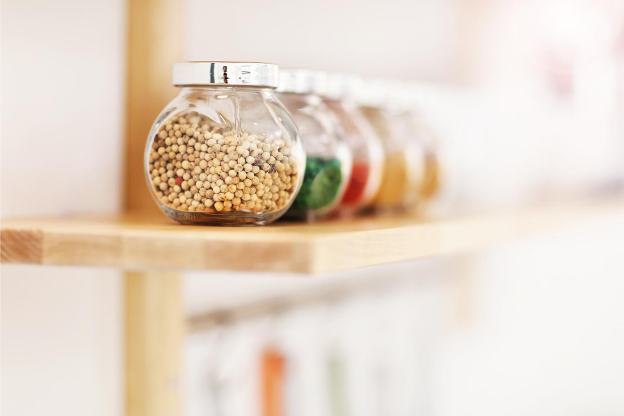 Spices lined up on shelf