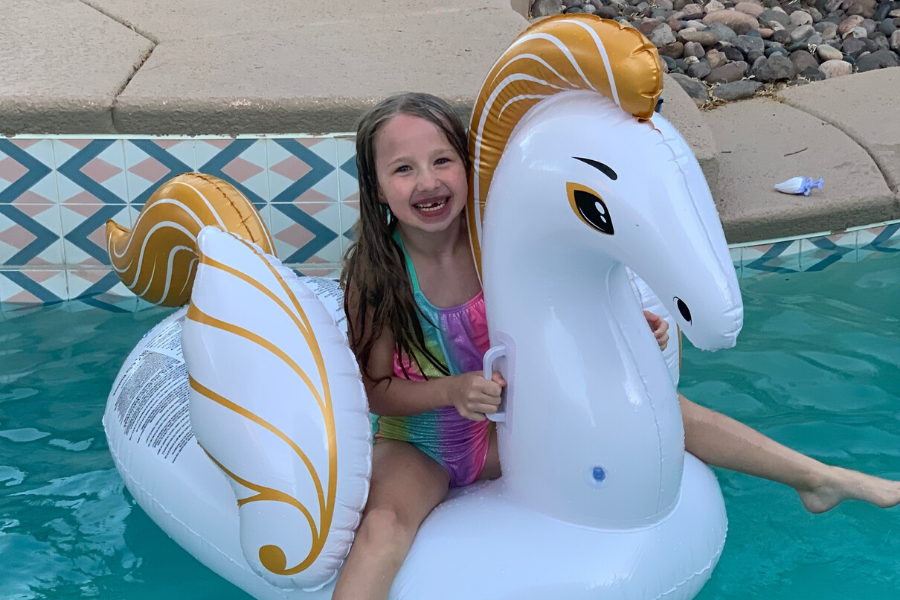 Daughter on pool float