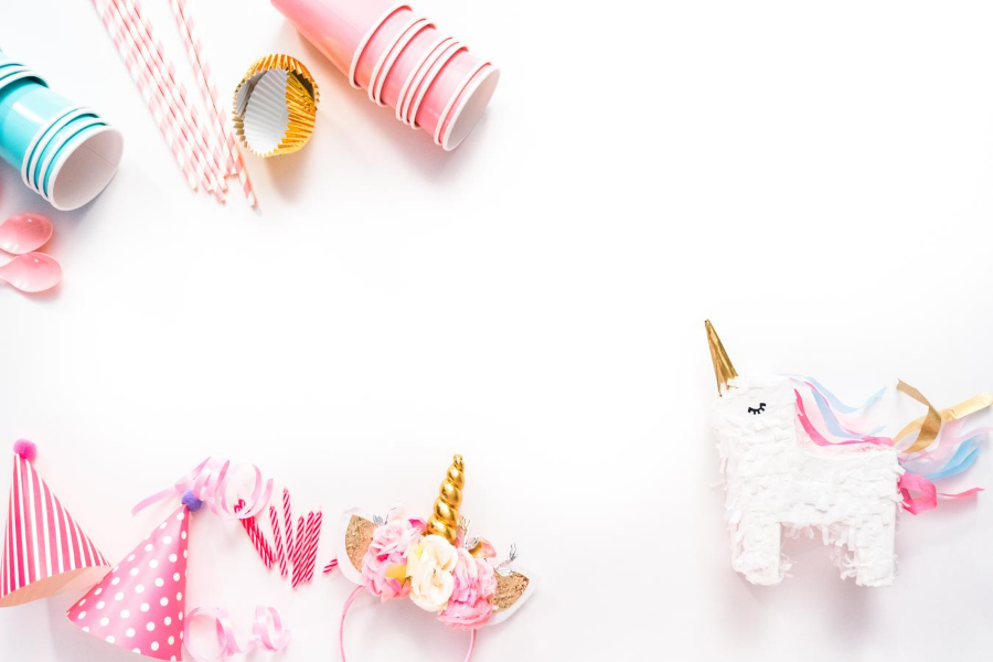 White background with party cups and unicorns