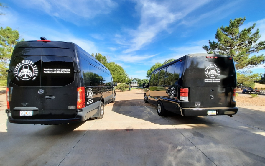 Two black tour buses