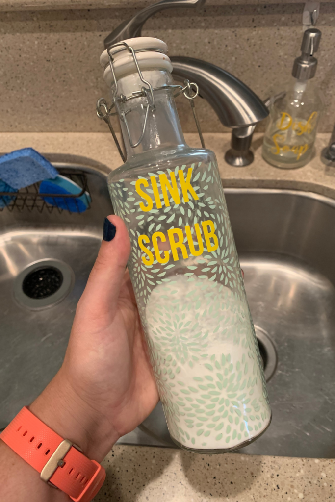 Hand holding sink scrub