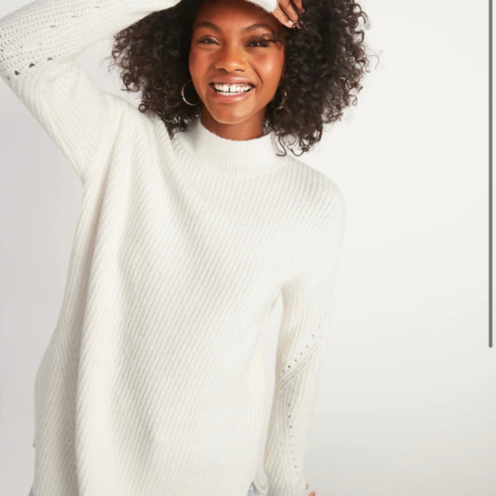 Woman wearing white sweater