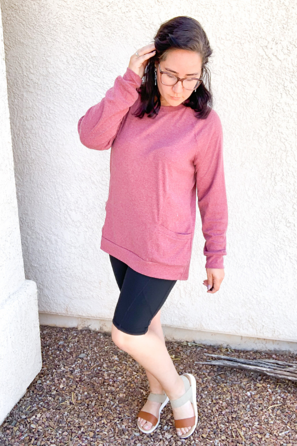 Rose sweater with black biker shorts and sandals