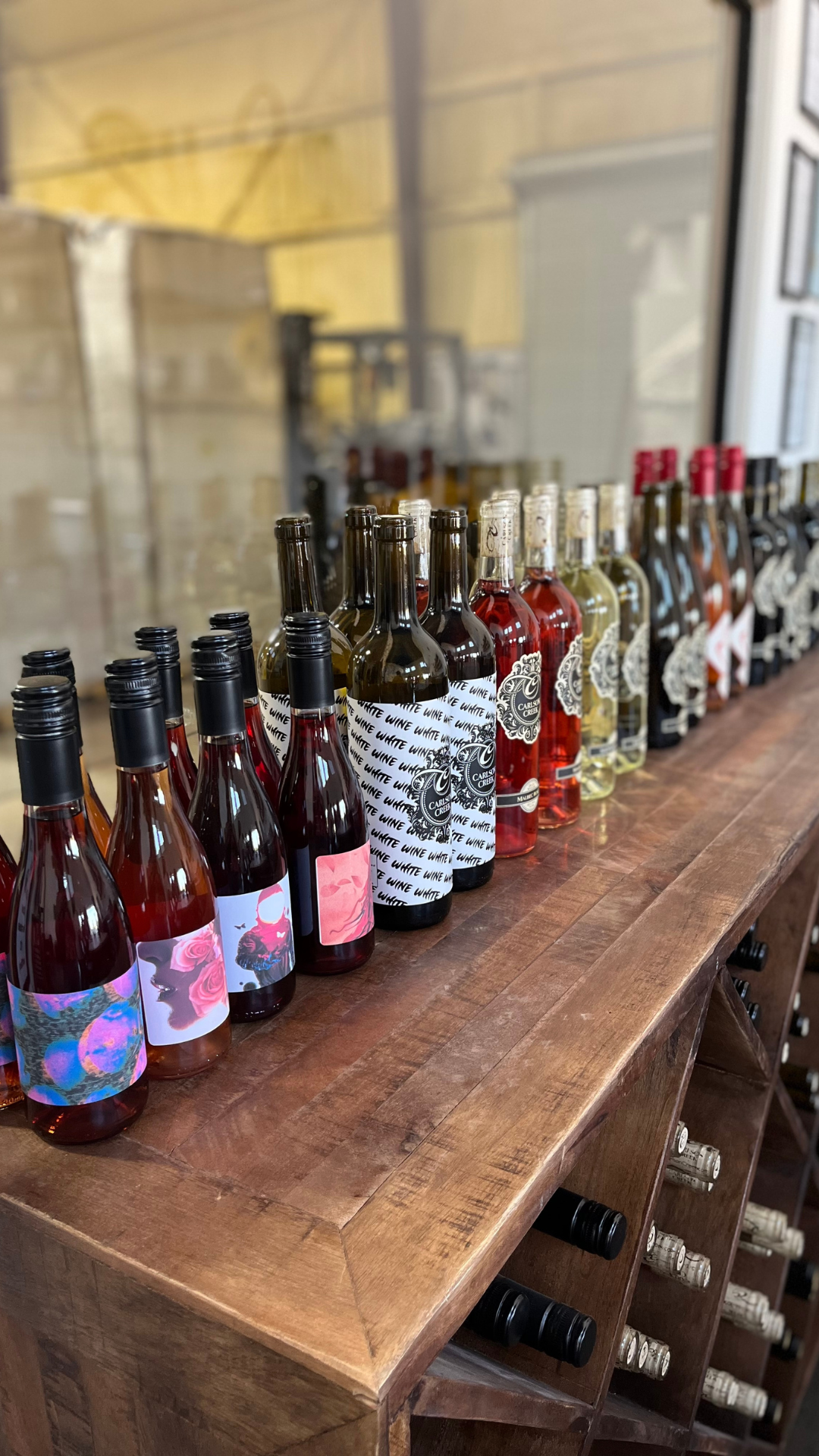 Wine bottles lined up on a table