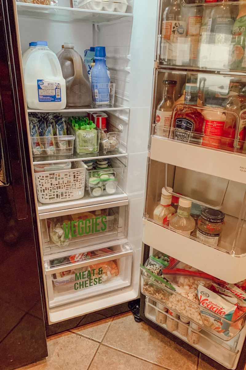 Open fridge with ranch cups and apple sauce