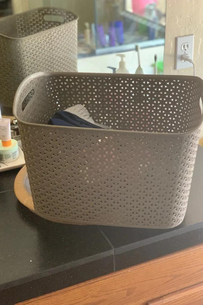 Brown plastic basket on a bathroom counter