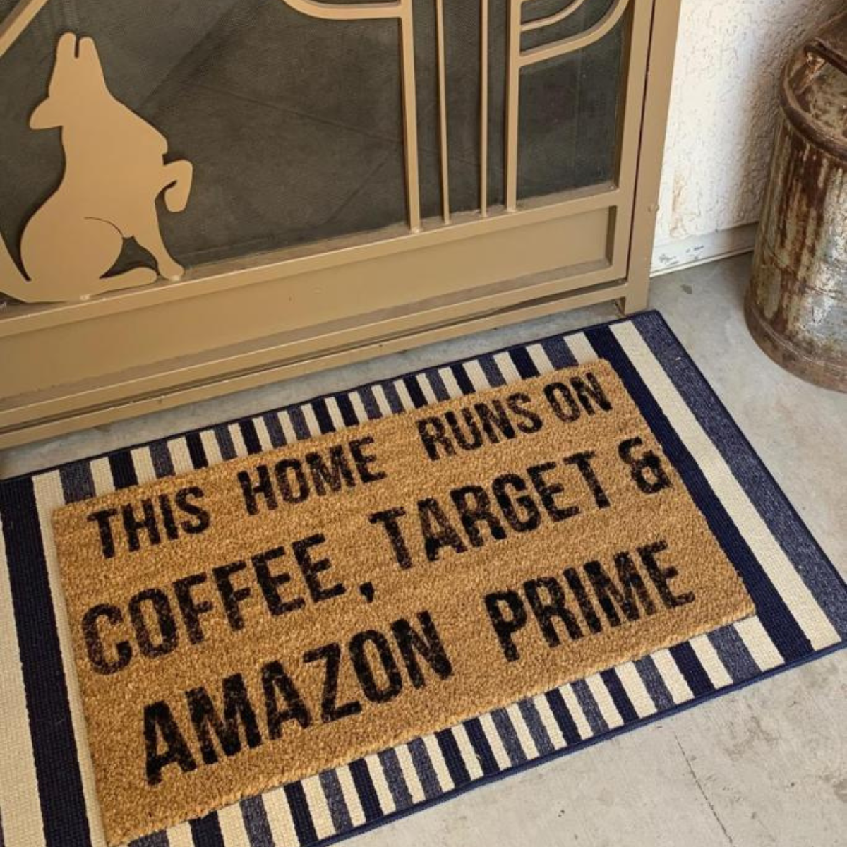 Front porch welcome mat that has black writing that says This Home Runs on Coffee, Target, and Amazon Prime