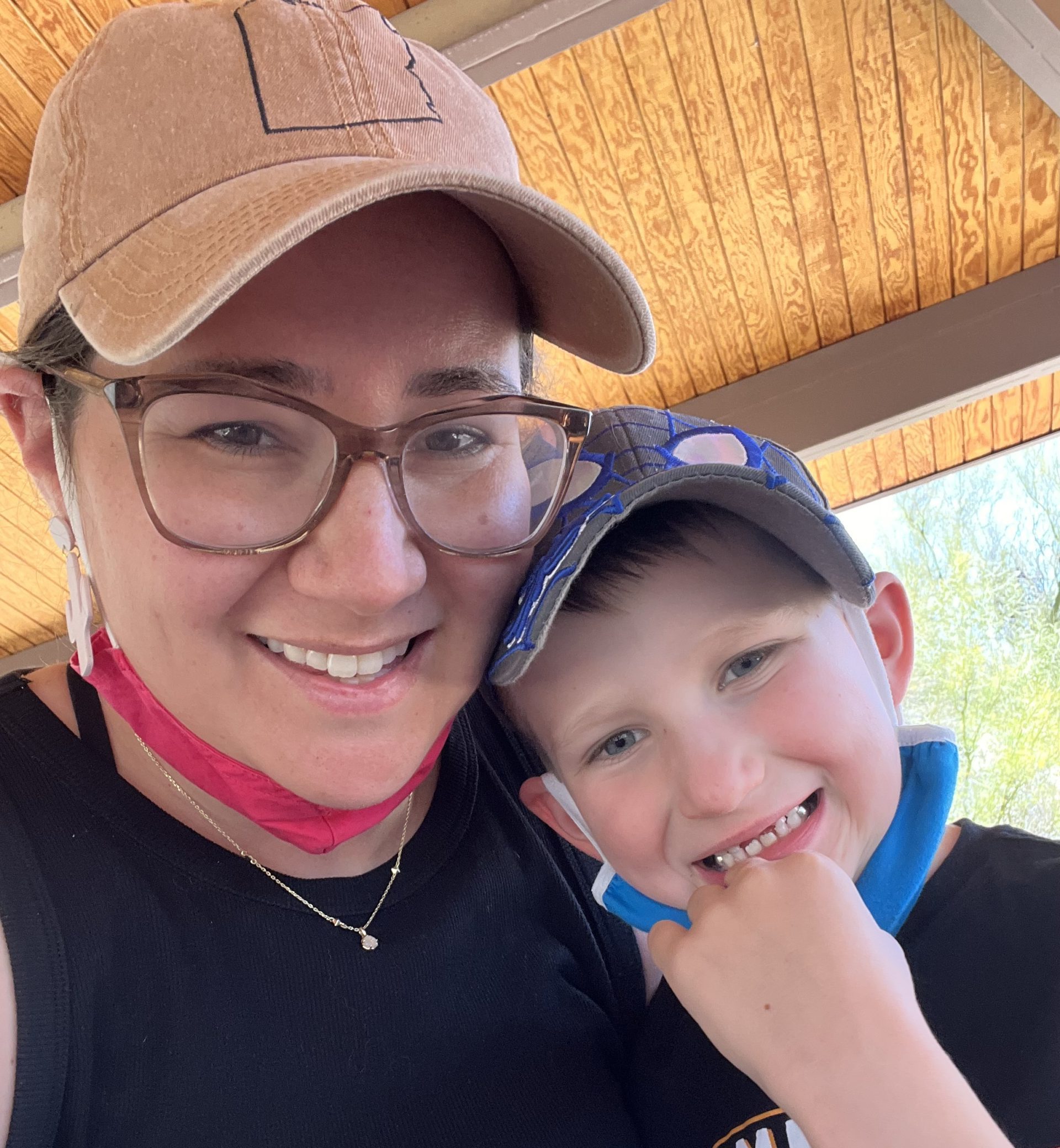 My son and I smiling with masks on