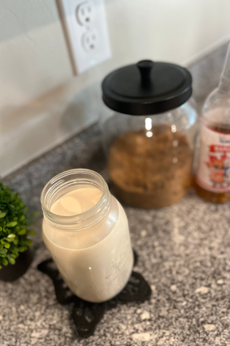 Garlic chicken in crock pot with bold white writing